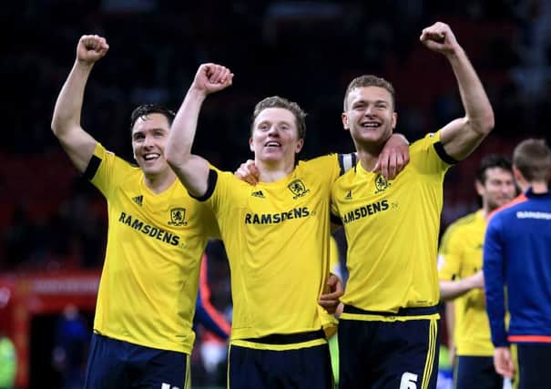 Middlesbrough's Stewart Downing, Grant Leadbitter and Ben Gibson celebrate the win at Old TRafford