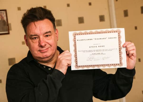 Steve Rose with his certificate presented by Silent Lambs.