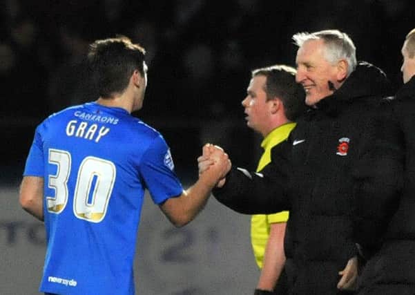 Ronnie Moore congratulates Jake Gray on his goal for Pools against Derby last week