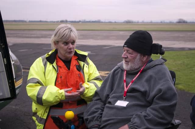 Roger Farwell, right, with Great North Air Ambulance Service paramedic Jane Peacock.