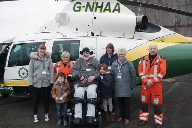 From left to right, carer Jo Spooner, paramedic Jane Peacock, Roger Farwell, Michelle Noble, Janice Farwell, paramedic Colin Clark. Front - Matthew Noble and Hannah Noble.
