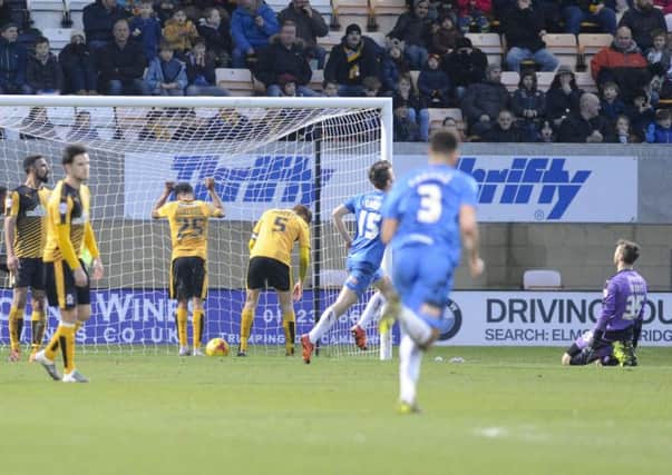 Jake Gray wheels away after scoring for Pools