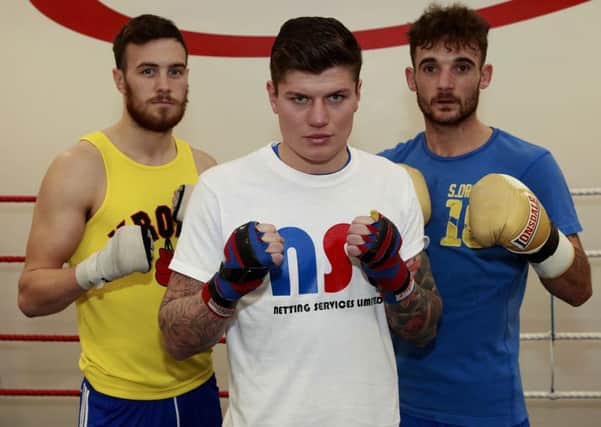 Peter Cope (centre) with Anth Hardy (left) and Billy Snaith at the Gus Robinson Boxing Gym Picture by DAVID WOOD