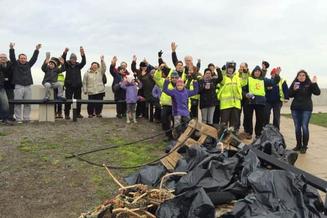 Some of the volunteers with the rubbish taken off the beach.
