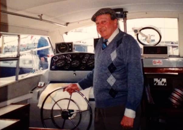 John Swales on board his boat.