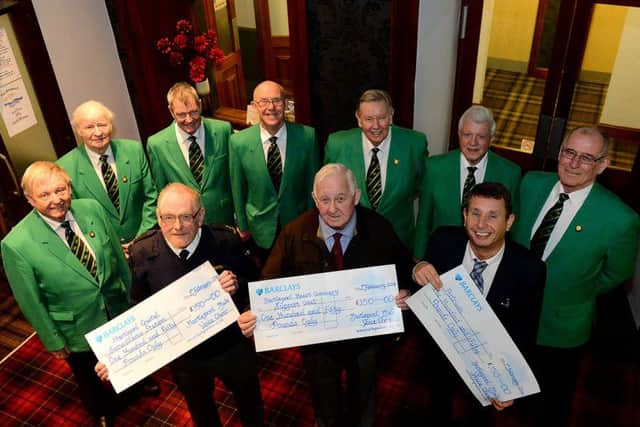 Hartlepool Male Voice Choir members (rear) as they presented cheques to (front left to right) Bill Wilson (Hartlepool Coastwatch),  Albert Armstrong (Hartlepool Coronary Support Group) and Colin Thompson (Artrium) Picture by FRANK REID