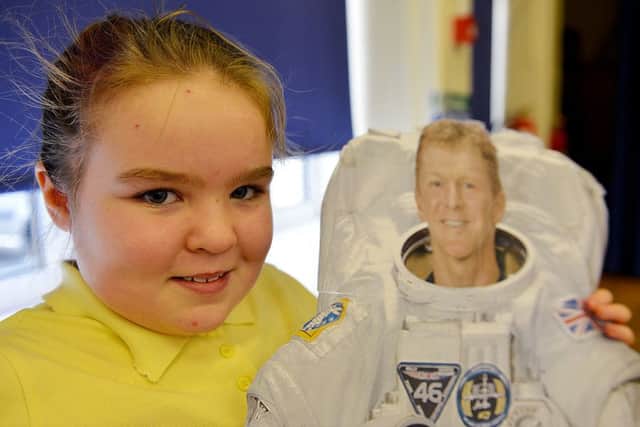 Chloe Gale with a photograph of British astronaut Tim Peake.