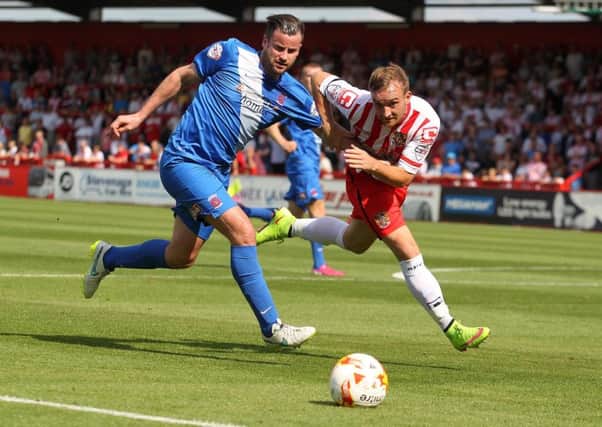 Pools' Matthew Bates takes on Stevenage back in August. The sides meet again at The Vic on Tuesday. Picture by Frank Reid