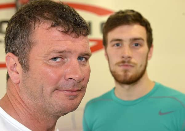 Boxer Anth Hardy with his trainer Peter Cope (left). Picture by FRANK REID