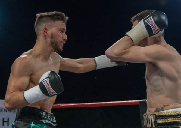 Sam O'Maison (left) connects to the head of Anth Hardy. Picture by James Williamson