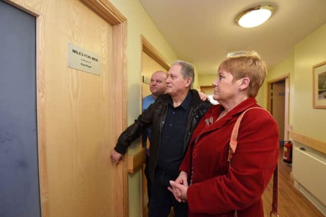 Michael Day (left) of Miles for Men with Alan and Janice Royal, outside the room at Hartlepool Hospice that Miles for Men opened and donated Â£5000 in memory of their son Paul, on Saturday.