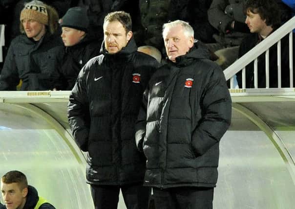 Ronnie Moore and Sam Collins look on last night