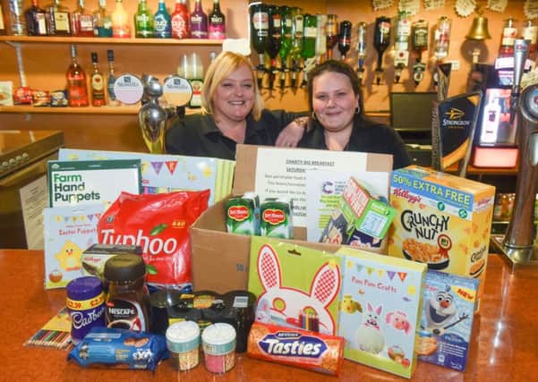 Donna Williamson (left) and Cheryl Ross bar staff at the Ye Olde Durhams Social Club, St Aidens Street, Hartlepool, who are running a big breakfast charity event in aid of Cancer Research UK.