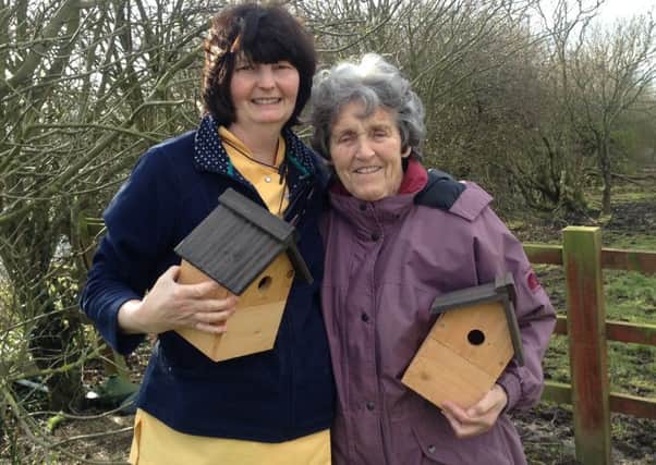 Janice Hardy with Field View care home resident Jean Drew and the bird boxes.