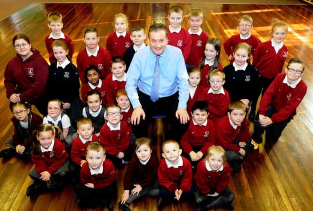 West View Primary school headteacher Andy Brown with pupils as they celebrate his 20 years at the school. Picture by FRANK REID