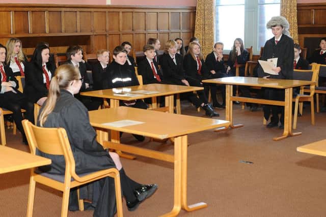 English Martyrs School pupils take part in the court session . Picture by FRANK REID