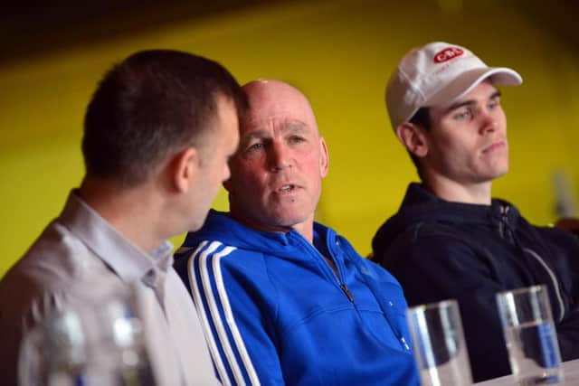 Neil Fannan speaks about Tommy Ward (in cap) at the boxing press conference at Houghton
