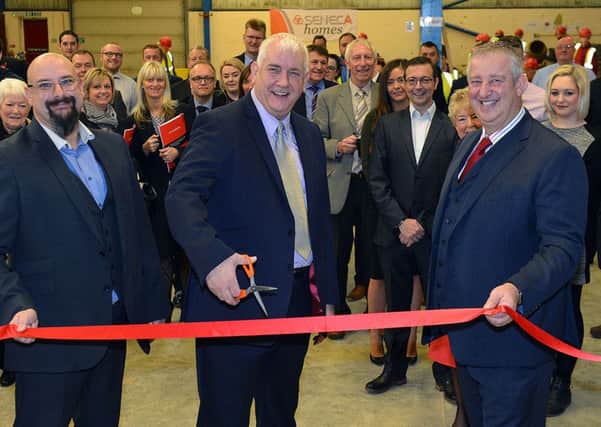 Directors Rob Morton, left, and Steve Willis, right, look on as Hartlepool councillor Kevin Cranney cuts the ribbon to open the Pro-active Training unit.