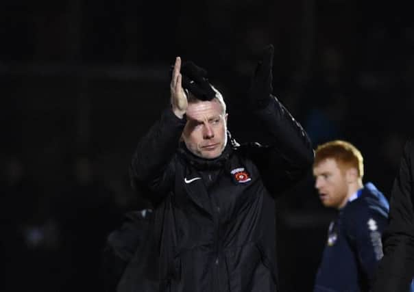 Craig Hignett applauds the travelling fans after the Bristol Rovers defeat