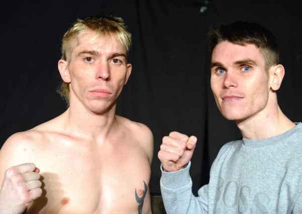 Robbie Turley and Tommy Ward (right) at their weigh-in at Rainton Meadows Arena yesterday. Picture by Stu Norton