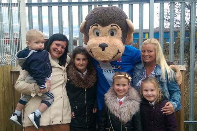 Eco Timber boss Richard Brackstones family posing with HAngus.