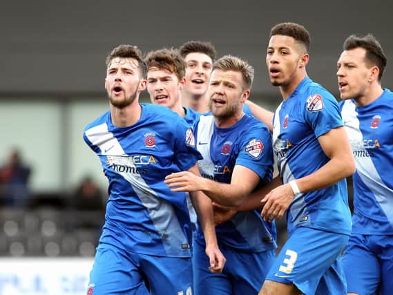 Pools celebrate the first Lewis Hawkins (left) goal. Picture by DAN WESTWELL