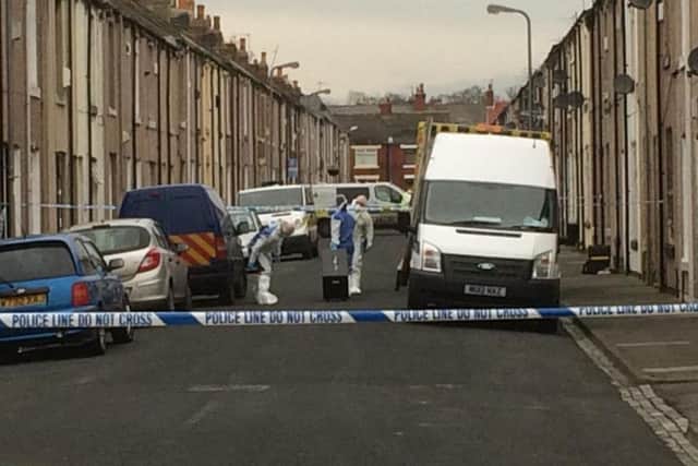 Police cordon off the area following the death of Angela Wrightson.
