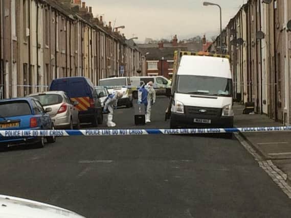 Police cordon off the area following the death of Angela Wrightson.