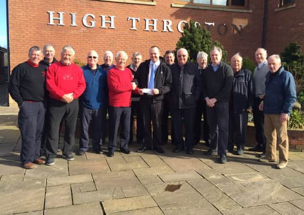 Members of High Throston Gold Club present the cheque to Giles Hildreth, from the hospice.