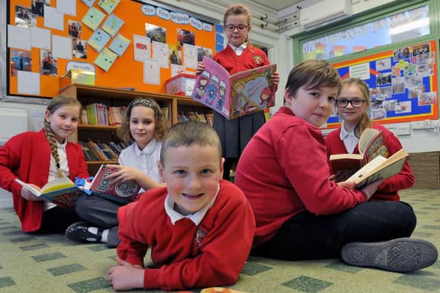 Hutton Henry Primary pupils, from left, Ellie Davis, Eve Mutton, Ralphie Pond, Pippa Hutchinson, Jackson Roberts and Beth Teahen reading their books during World Book Day.