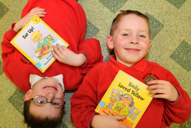 Robert Clark, left, and Bob Turnbull with their books during World Book Day.