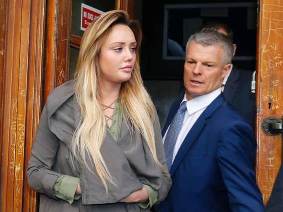 Geordie Shore star Charlotte Crosby leaves court with her solicitor after receiving a three-year driving ban.
