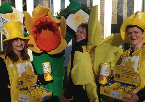 Fundraisers collecting for Marie Curie's Great Daffodil Appeal.