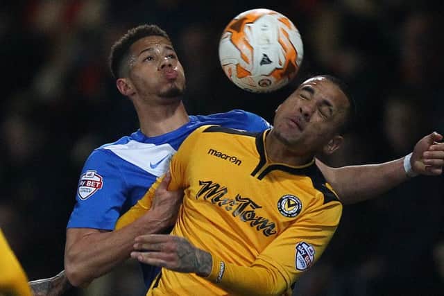 Jake Carroll battles for the ball at Newport