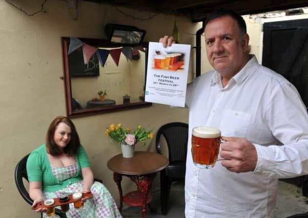 Paul and Lana Williams from The Fishermans Arms with a selection of drinks on offer at their Beer Festival.