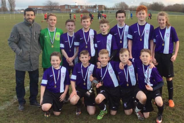 Julio Arca, left, coached the Dyke House squad, featuring Brooke Newton, back row far right, to victory in the Year 8 Cleveland County Cup.