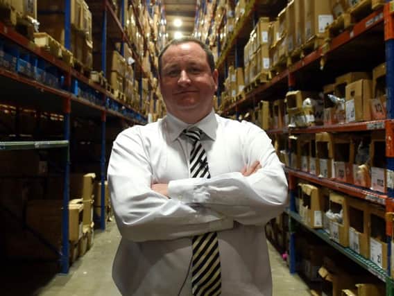 Newcastle United owner Mike Ashley in the picking warehouse during a tour of the Sports Direct headquarters in Shirebrook, Derbyshire.