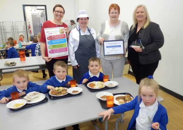 School Meals Team Member Jeanette Strong, Cook Amanda Pearson, Councillor Marjorie James and Lynne Bell. Pictured front row (l-r) are Cole Fox, Jude French, Joshua Beha and Ruby Dolan.