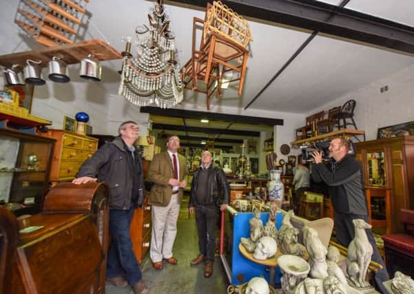 BBC Antiques Road Trio expert Paul Laidlaw (2nd left) being filmed with Alan Bamford (left) and Alan Padgett (3rd left) the owners of Kiwi Trading, Osborne Road, Hartlepool, for a future episode.