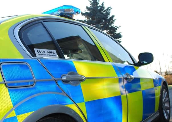 Police are appealing for information after two men in a car followed a woman walkingalong Elizabeth Way in Hartlepool.