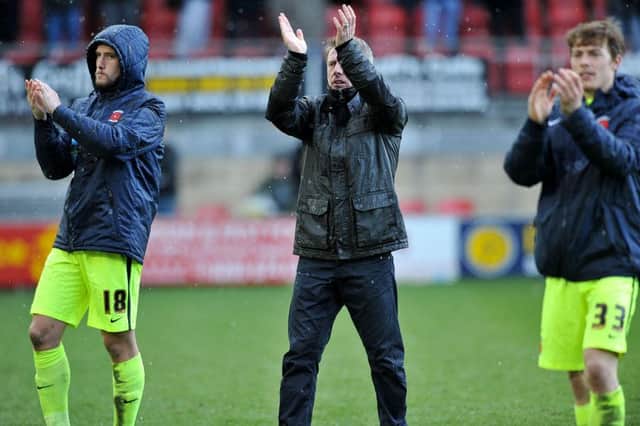 Craig Hignett applauds the travelling Pools fans after the Orient win