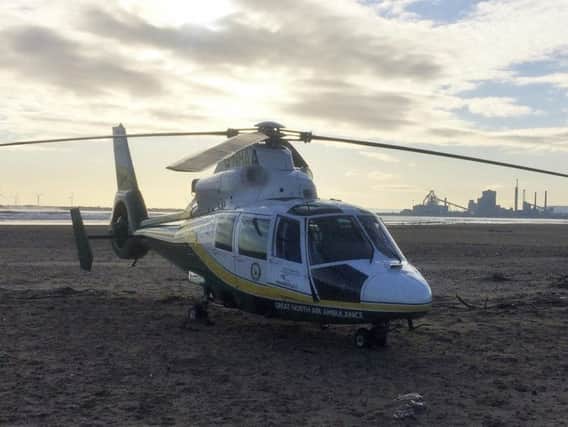 A man was airlifted to hospital after falling on sand dunes in Hartlepool.