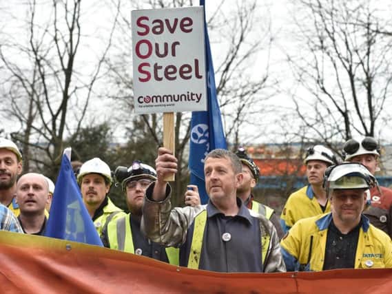 Steelworkers worried for their jobs get their message across.