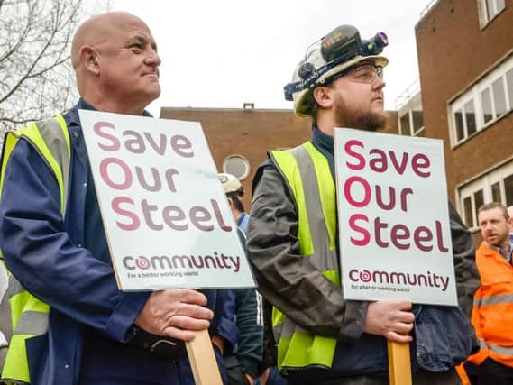 Workers waiting to speak to Business Secretary Sajid Javid as he leaves
Tata Steel in Port Talbot, South Wales. PRESS ASSOCIATION Photo.  Ben Birchall/PA Wire