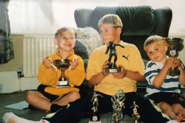 Nathan, Aaron and Eldon Myers when they were children. Picture from Mercury Press.