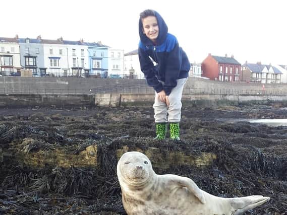 Ten-year-old Louis with the seal,