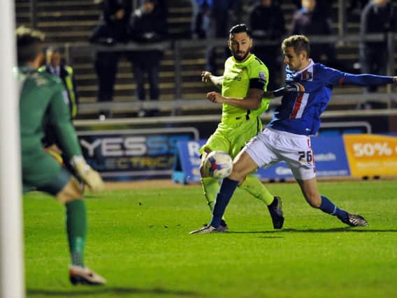 Hartlepool United captain Billy Paynter gets in a shot during the 2nd half at Carlisle.