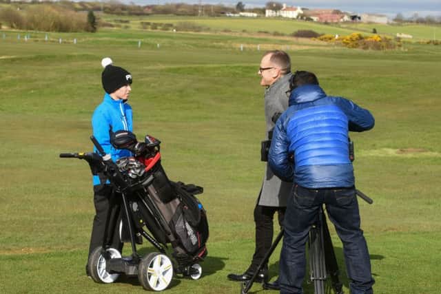 BBC Look North presenter Jeff Brown interviews Seaton Carew golfer Jack Burton before he tees off in the Graeme Storm Junior Open at Hartlepool Golf Club. Picture by Kevin Brady