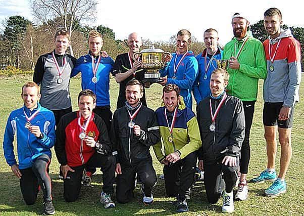 Morpeth Harriers Senior Men's winning English National 12 Stage Road Relay squad at Sutton Park with trophy and medals. Back row, from left, Chris Smith, Nick Swinburn, Ian Hudspith, Lewis Timmins, Peter Newton, Richard Morrell, Ryan Stephenson. Front row, from left, Carl Avery, Ady Whitwam, Nathan Shrubb, Kevin Calvert, Andy Wiles.