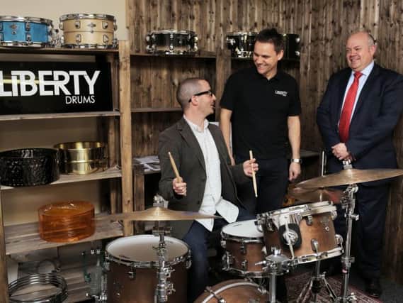 Andrew Street of Liberty Drums, customer Hugh Lawrence with his bespoke drum kit and Business Durham MD Simon Goon. Picture by Stuart Boulton.